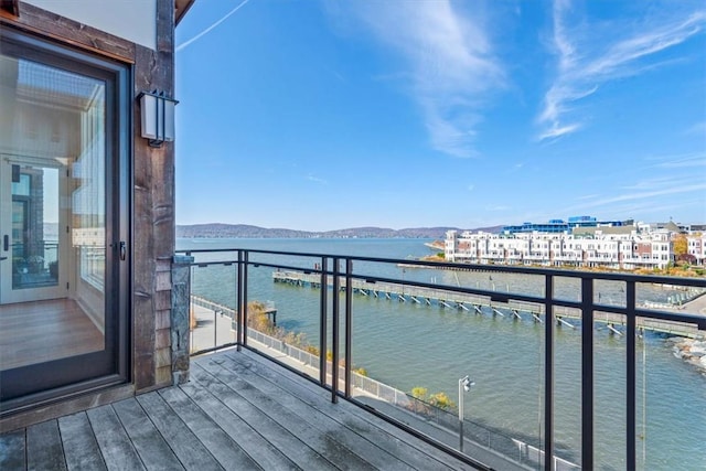 balcony with a water and mountain view