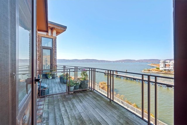 balcony with a water and mountain view