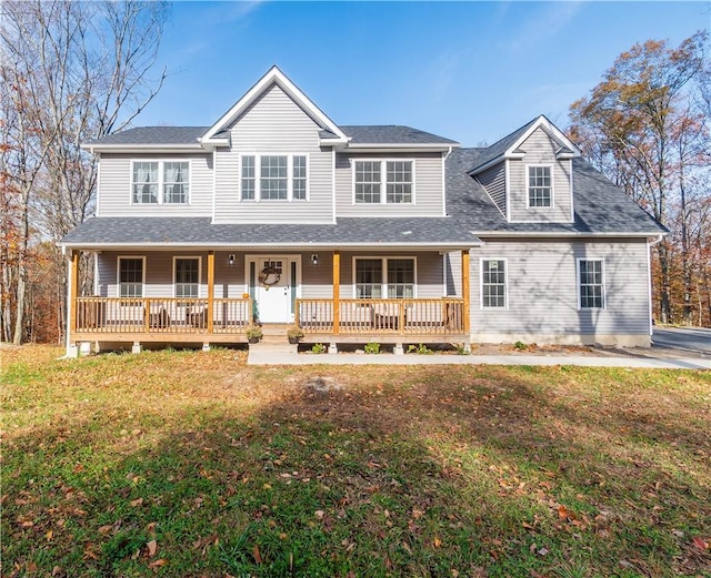 view of front of property with a porch and a front lawn