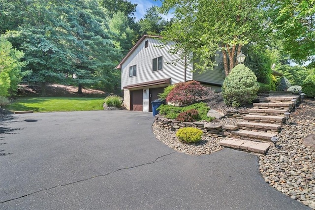 view of side of home featuring a garage