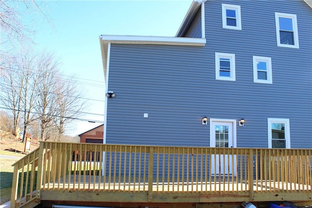 back of house with a wooden deck