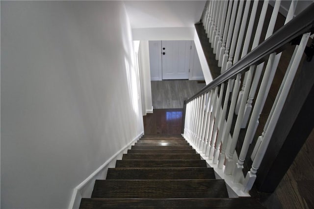 stairs with wood-type flooring