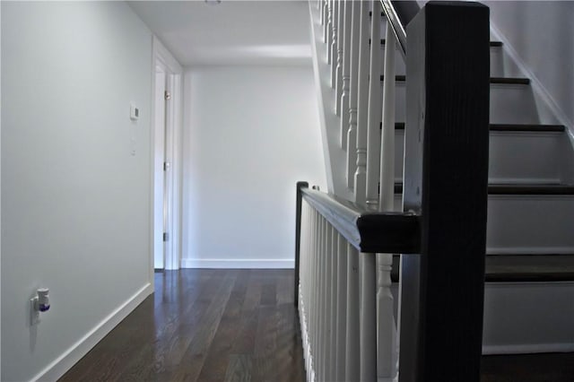 corridor with dark hardwood / wood-style floors