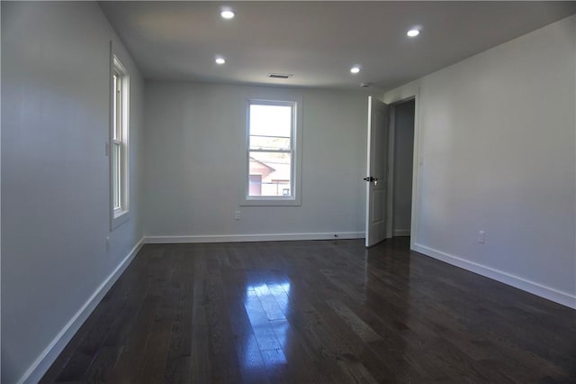 unfurnished room with dark hardwood / wood-style floors