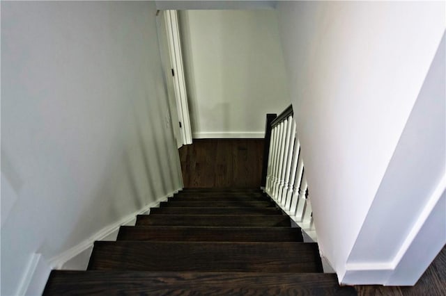 stairway featuring hardwood / wood-style flooring