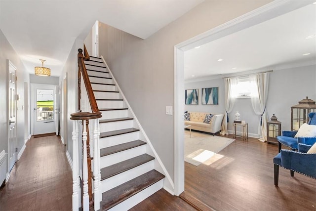 staircase with hardwood / wood-style flooring