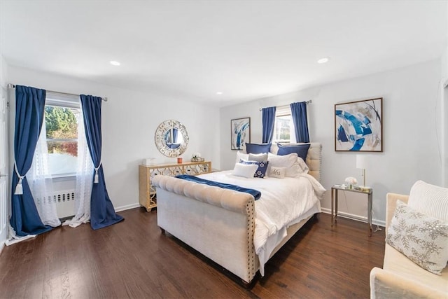 bedroom with dark hardwood / wood-style floors