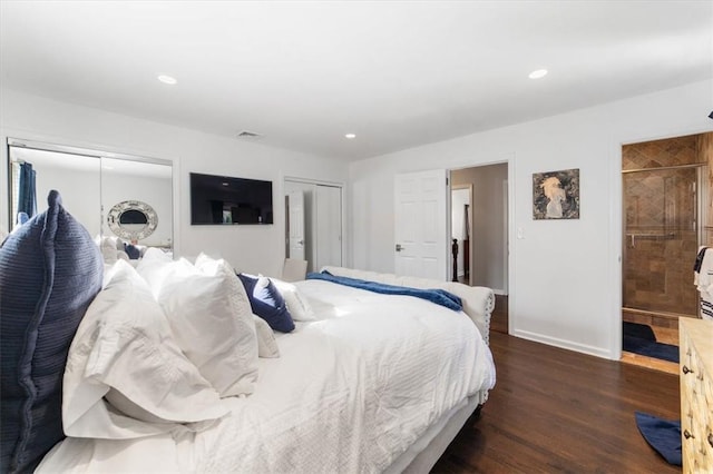 bedroom featuring dark hardwood / wood-style floors and ensuite bath