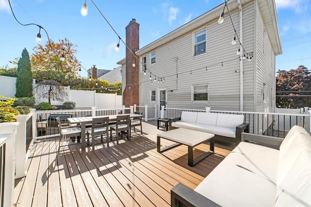 wooden terrace with outdoor lounge area