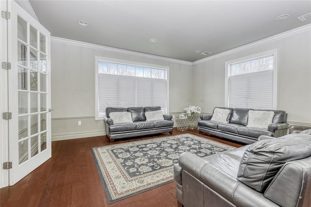 living room with a wealth of natural light, crown molding, and dark hardwood / wood-style floors