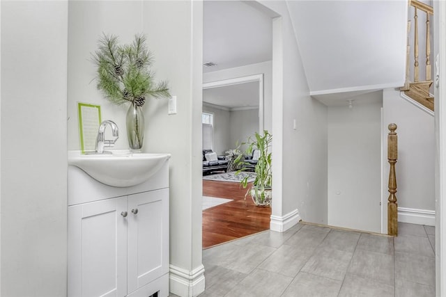 bathroom featuring vanity and wood-type flooring