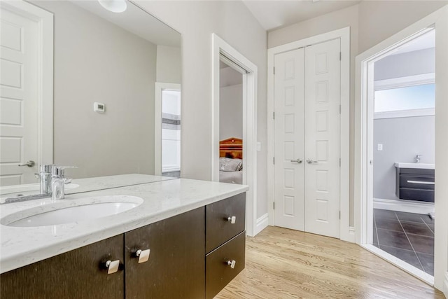 bathroom featuring vanity and wood-type flooring