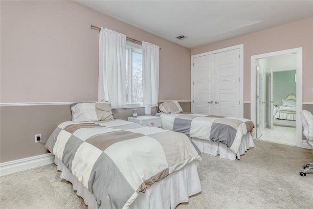 carpeted bedroom featuring a closet