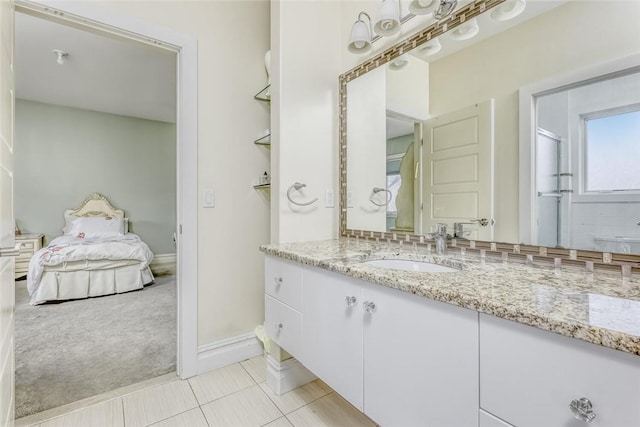 bathroom featuring tile patterned floors and vanity