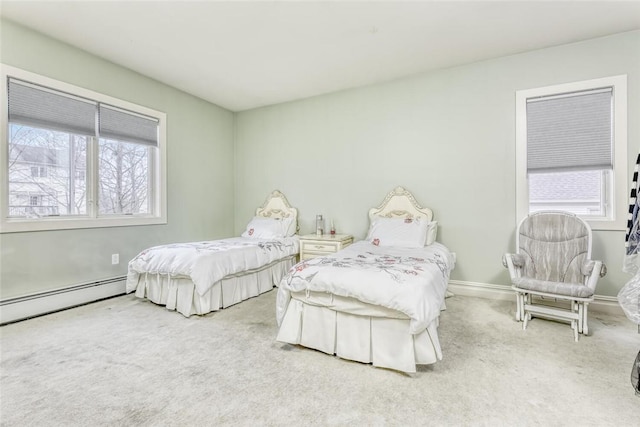 carpeted bedroom with multiple windows and a baseboard heating unit