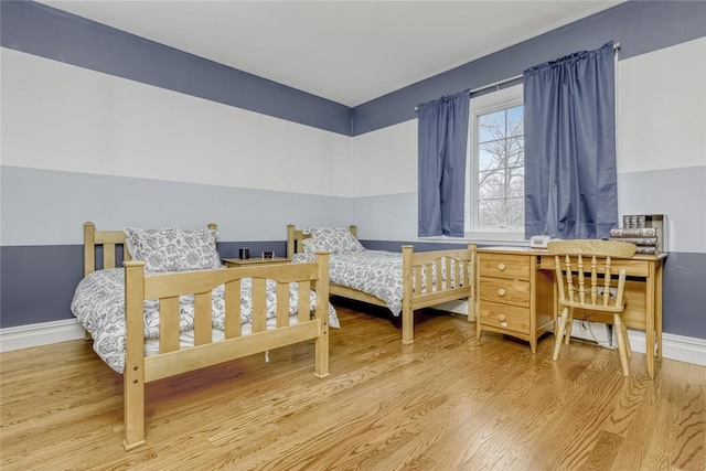 bedroom with light hardwood / wood-style floors