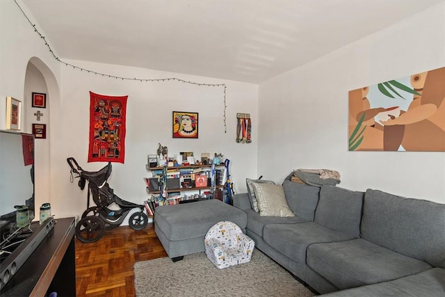 living room featuring dark parquet floors