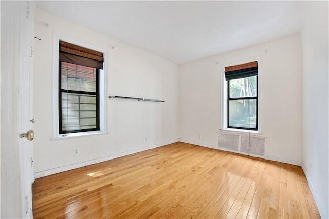 unfurnished room with light hardwood / wood-style flooring