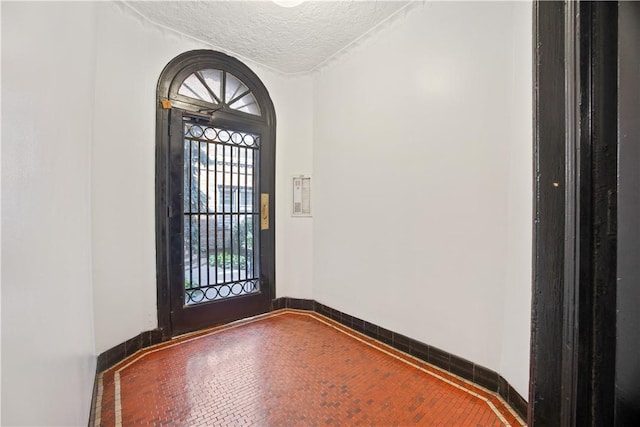 entrance foyer featuring a textured ceiling