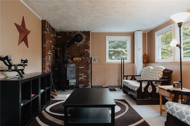 sitting room featuring a wood stove