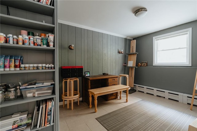 miscellaneous room featuring light tile patterned floors, wooden walls, and a baseboard radiator