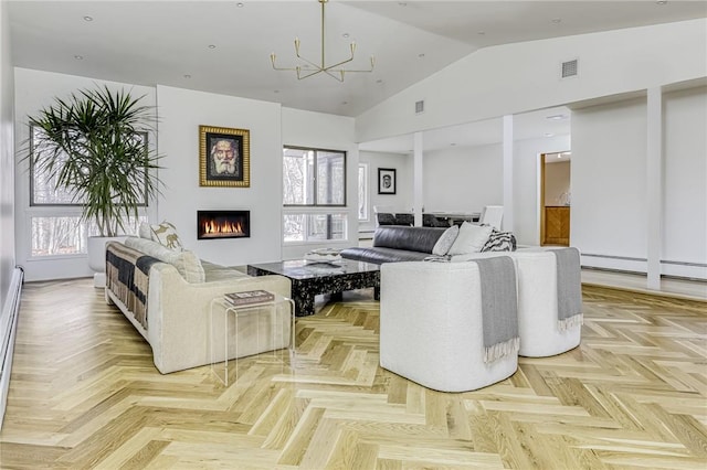 living room with a chandelier, light parquet floors, a wealth of natural light, and lofted ceiling