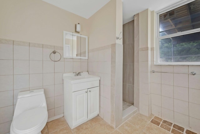 bathroom with toilet, tile walls, and walk in shower