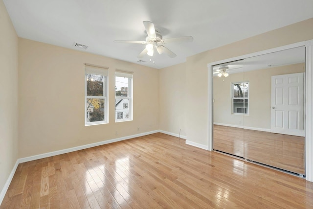 spare room featuring hardwood / wood-style flooring and ceiling fan