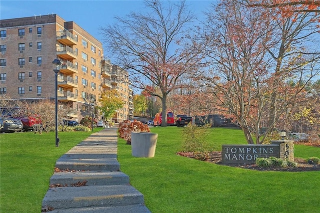 view of property's community with a yard