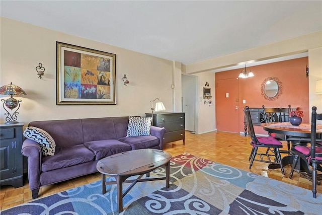 living room featuring parquet flooring and a notable chandelier