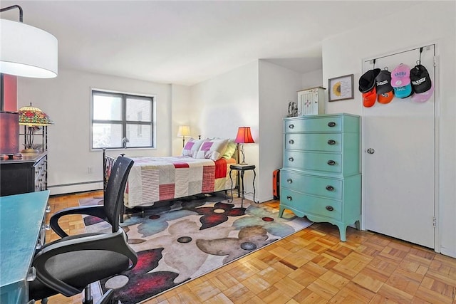 bedroom featuring light parquet flooring and a baseboard radiator