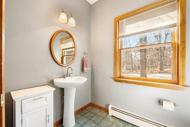 bathroom featuring baseboard heating and tile patterned flooring