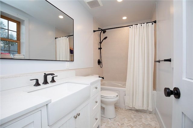 full bathroom with toilet, vanity, and shower / tub combo with curtain