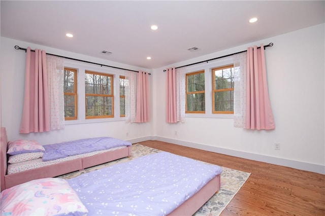 unfurnished bedroom with light wood-type flooring