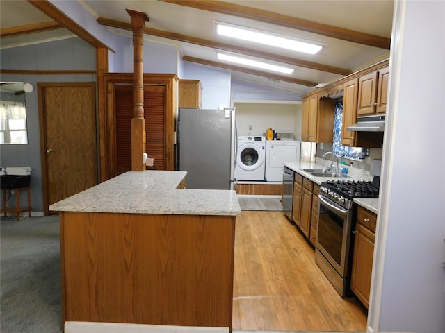 kitchen with washer and clothes dryer, lofted ceiling with beams, sink, light hardwood / wood-style flooring, and stainless steel appliances