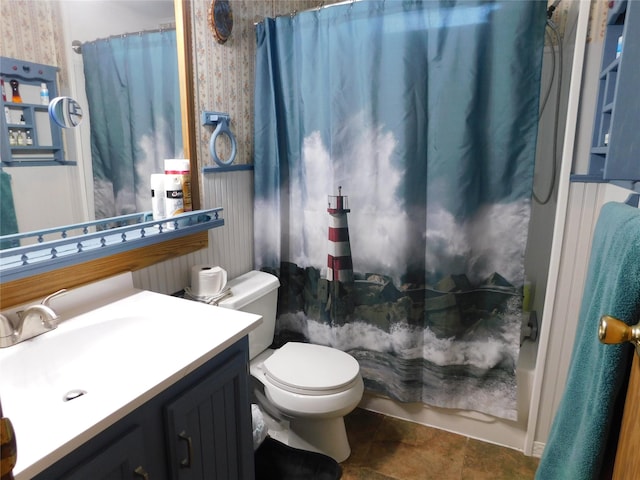 full bathroom featuring tile patterned flooring, shower / tub combo with curtain, vanity, and toilet