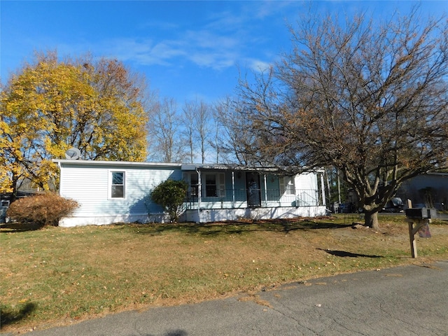 view of front of home featuring a porch and a front lawn