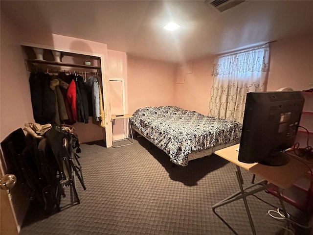 carpeted bedroom with a closet