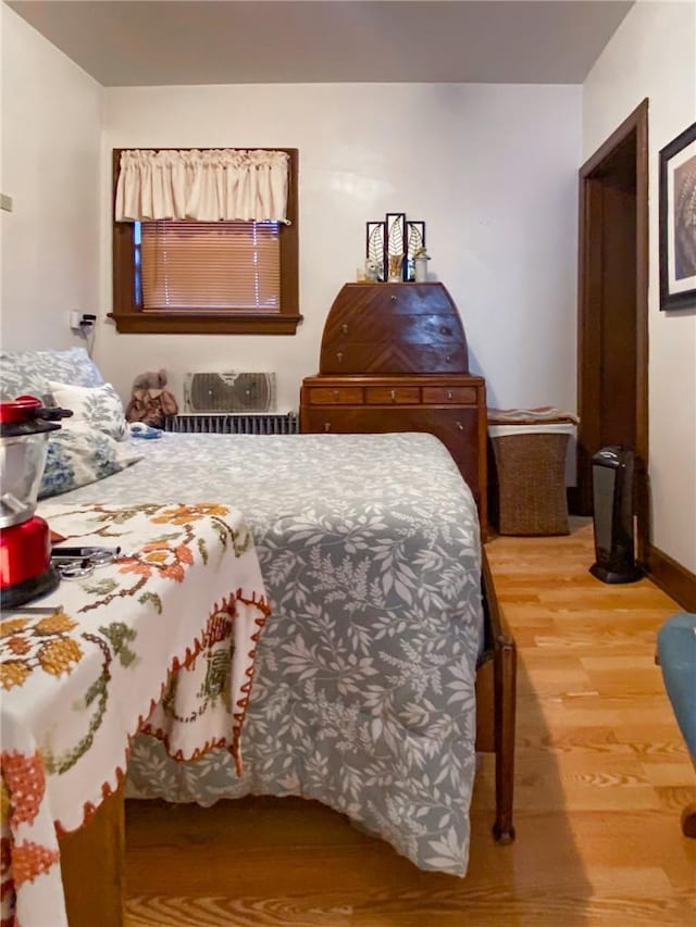 bedroom featuring hardwood / wood-style flooring