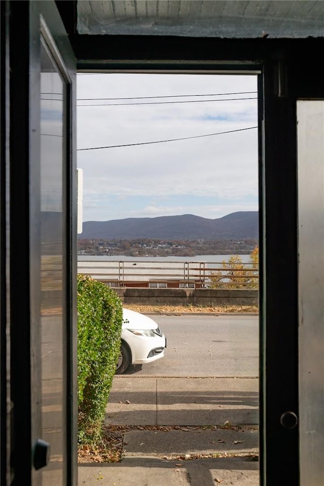 entryway with a mountain view and concrete floors