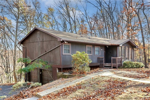 view of front facade with a sunroom and a garage