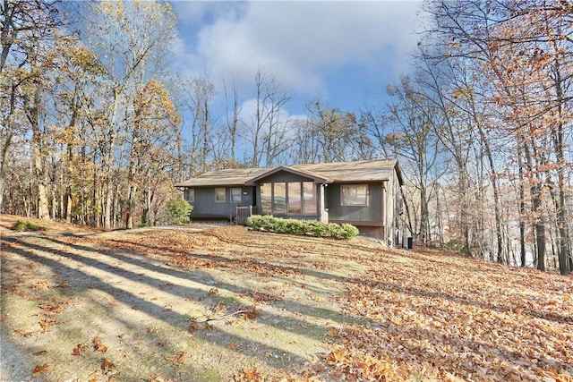 ranch-style home with central air condition unit