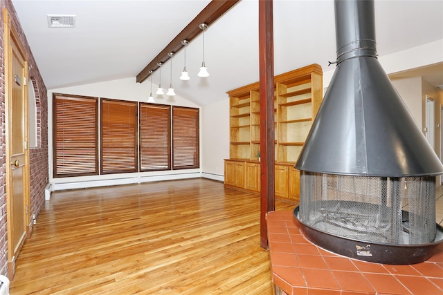 unfurnished living room with hardwood / wood-style flooring, lofted ceiling with beams, brick wall, and a baseboard radiator