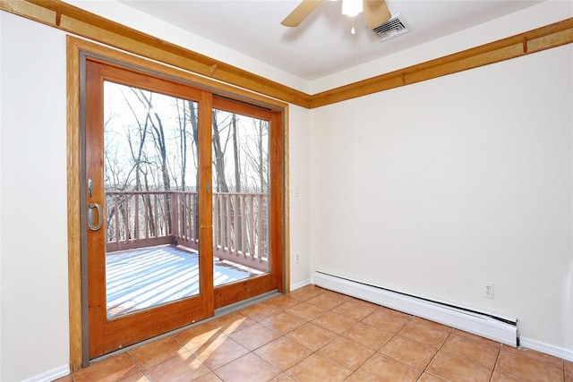 doorway to outside featuring ceiling fan, light tile patterned floors, and a baseboard heating unit