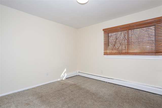 empty room with carpet and a baseboard radiator