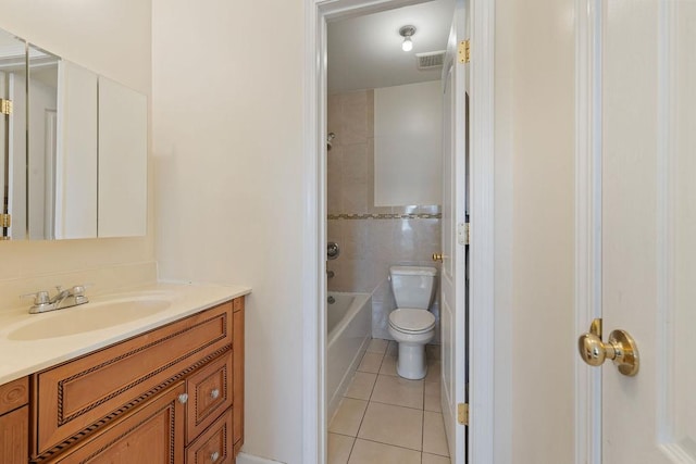 full bathroom featuring tile patterned floors, toilet, shower / washtub combination, vanity, and tile walls