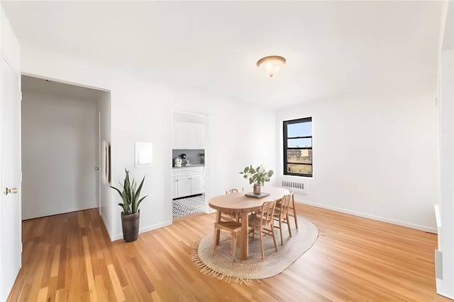 19 Old Mamaroneck Rd Unit 6D, White Plains, NY 10605 - dining area featuring light wood-style floors and baseboards
