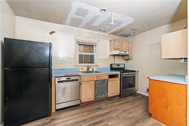 kitchen featuring hardwood / wood-style floors, sink, and appliances with stainless steel finishes