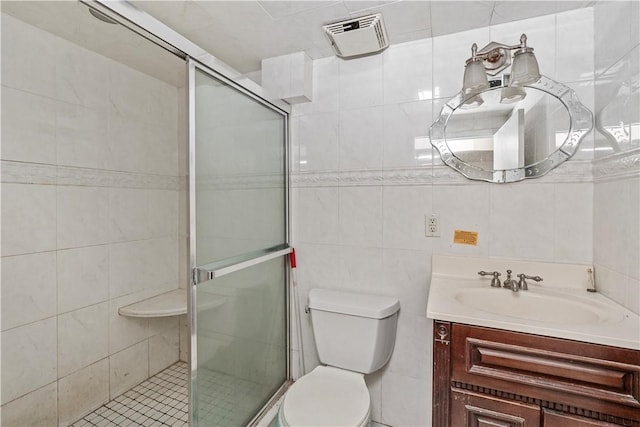 bathroom featuring vanity, an enclosed shower, and tile walls