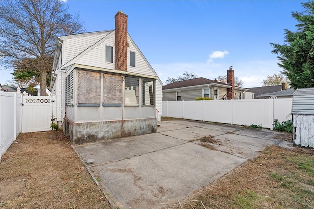 rear view of house featuring a patio